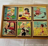 Tiles arranged in box showing illustrations