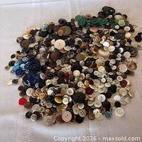 Top view of full spread of assorted buttons