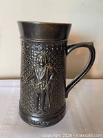 Front view showing raised Hamlet figure and overall glaze