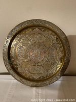 Full view of brass tray front showing overall design