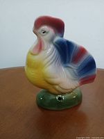Front view of multicolor ceramic rooster figurine