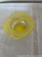 Top view showing yellow and clear spiral stripes inside bowl