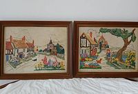 Both framed needlepoint artworks front view