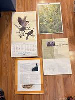 Four 1982 wall calendar pages laid on floor