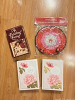 Group view of board game, sealed Love Dart set, two keepsake boxes