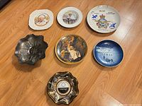 All seven plates and bowls displayed