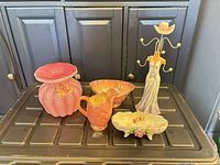 Group shot of all five porcelain and resin items on surface