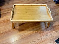 Full view of bamboo tray with legs extended