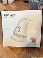 Front of box showing Body Sculpt handheld massager image and model information