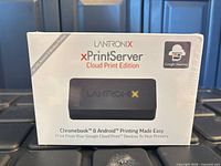 Front view of sealed Lantronix xPrintServer Cloud Print Edition box