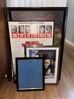 All four framed pieces stacked together showing sizes and frames