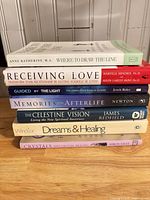 All seven books stacked, titles and authors visible