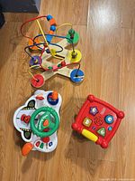 overview of three toys on floor