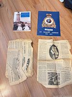 Group shot showing book, booklet, stacked Old Favorites pages, loose Mother and Baby article