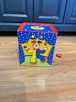 Front view showing clown graphic and hand crank