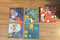 Four folded posters showing portions of each design