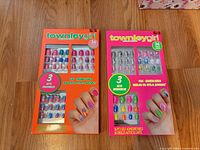Two boxes of townleygirl 36-piece nail sets on floor