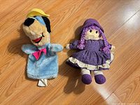 Both the Huckleberry Hound puppet and rag doll on floor for size comparison