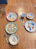 Group view of all nine dinnerware items on floor