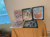 All five assembled puzzles on display