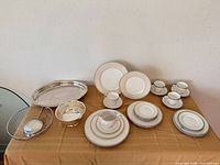 Full lot overview showing china sets and silver pieces