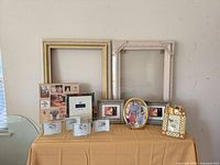 Overall lot showing large wall frames, tabletop frames, collage frame
