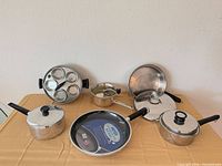 Full view of all cookware pieces arranged on table