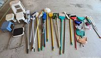 Full lot laid out showing stools, long-handled tools and small accessories