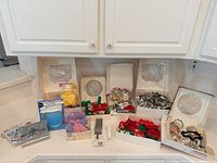 Full lot on countertop showing boxed tools and multiple groups of cookie cutters