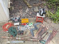 Wide view of entire lot showing all tools spread on driveway