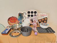 Overview of entire mixed bakeware bundle displayed on table