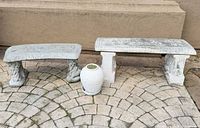 View of both cast stone benches and urn planter on patio