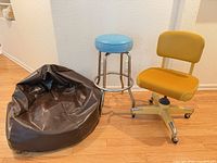 Bar stool, desk chair and bean bag grouped
