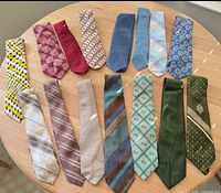 All fourteen neckties displayed for pattern and color reference