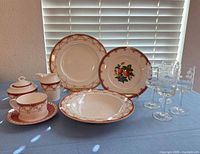 Overall lot showing dinnerware pieces and stemware