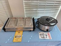 Bella triple buffet server and Cooks slow cooker side by side on table