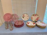 Full lot showing all plates, bowls and glasses