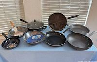 Group shot of all nine pans on table