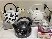 Three animal kettles, Teavana warmer, infuser box
