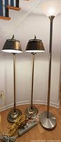 Three floor lamps standing side by side showing overall style and size comparison