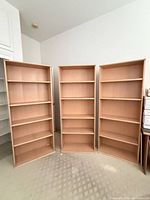 Front view showing all three bookcases side by side