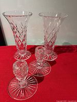 Group shot showing two vases and two candle holders