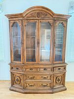 Front view showing full cabinet with glass doors and drawers