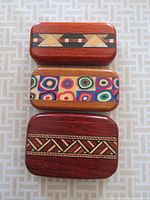 Top view of three stacked boxes showing decorative inlays