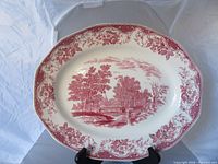 Full view of red transferware platter front