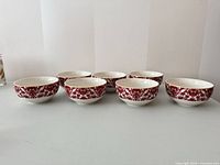Seven matching bowls displayed rim up