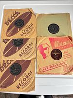All five 78 RPM records with sleeves displayed