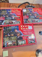 Three Tree Train boxed sets on table