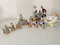 Group shot of all ten porcelain figurines