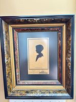 Full view of framed boy silhouette artwork